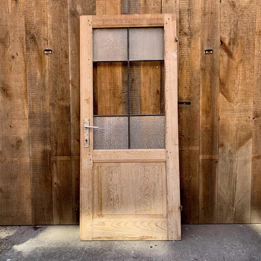 Antique door, glazed and stripped, 77x177cm.