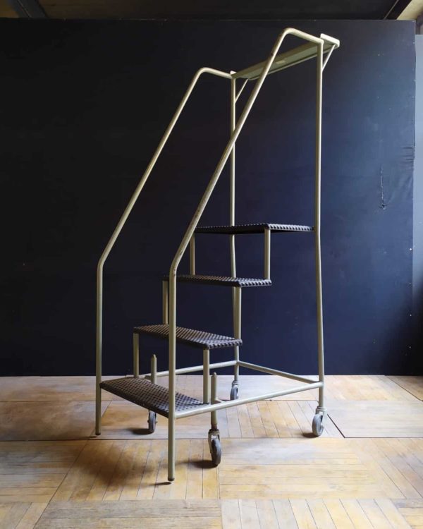 Metal step ladder on wheels 4 steps.