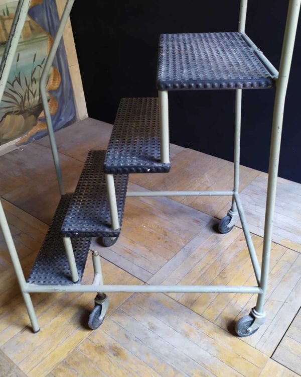 Metal step ladder on wheels 4 steps.