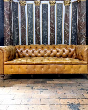 Beige leather chesterfield sofa face