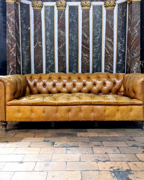 Beige leather chesterfield sofa face