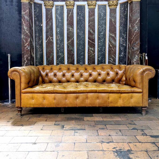 Beige leather chesterfield sofa face