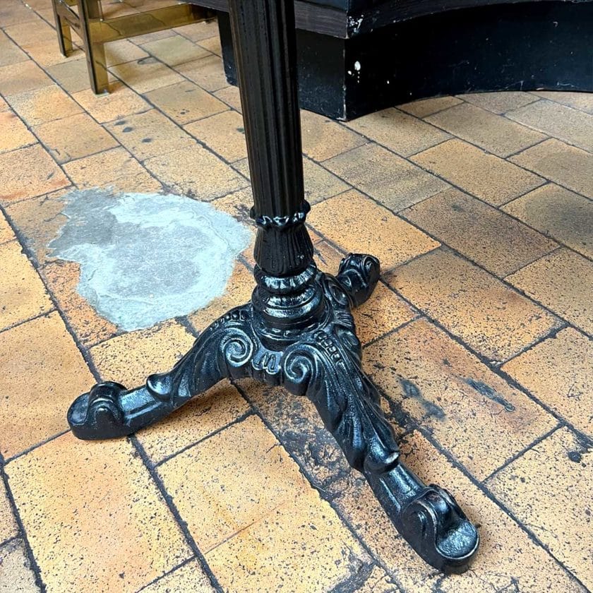 Bistro table with cast-iron feet