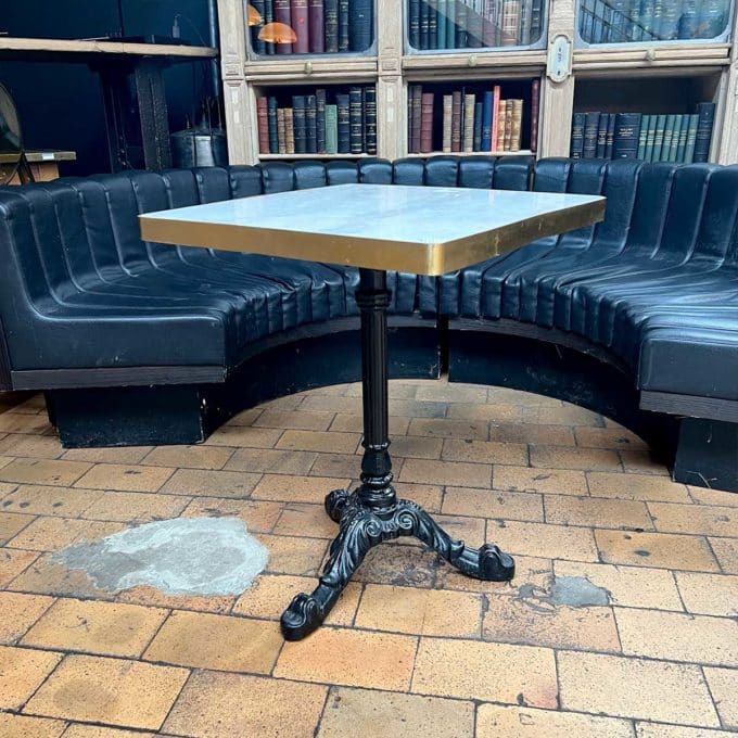 Bistro table with cast-iron legs side