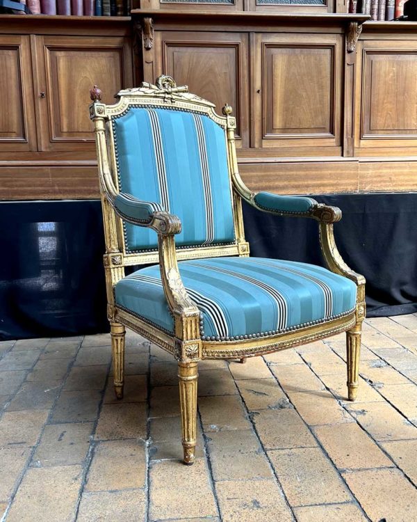 Gilded molded wood armchair