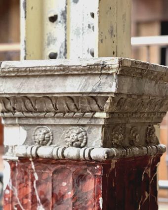 Pair of half-columns in faux red marble top