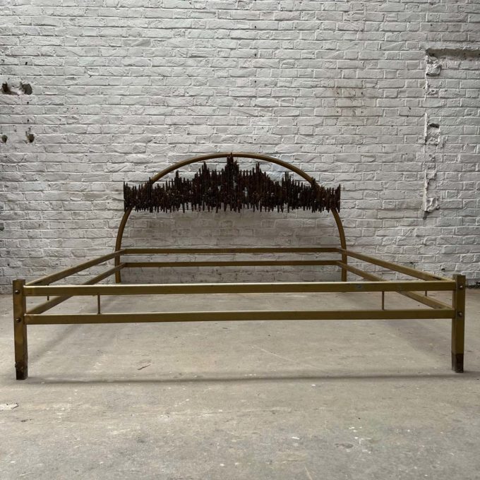Bed with bronze headboard