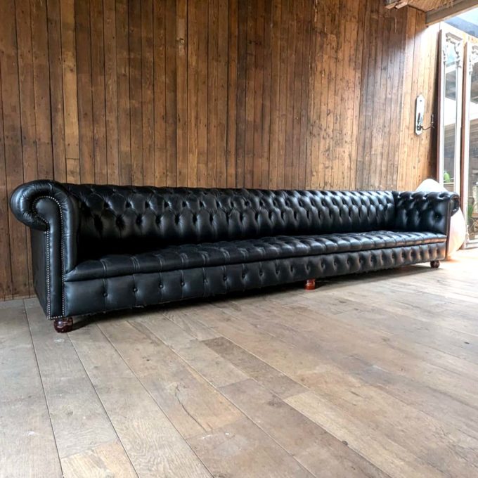 4m long black Chesterfield sofa
