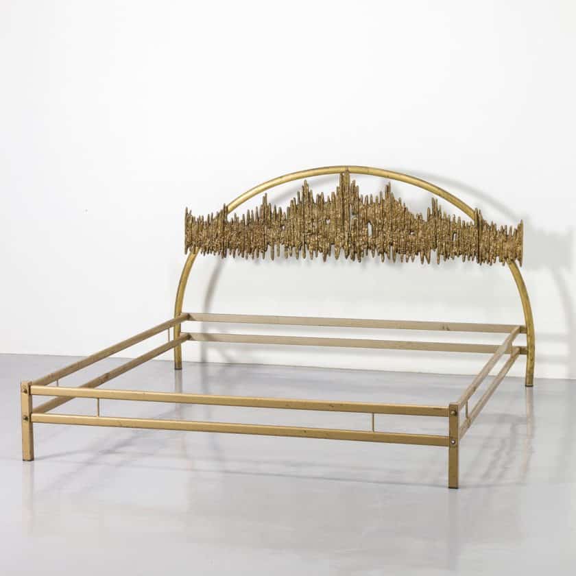 Bed with bronze headboard