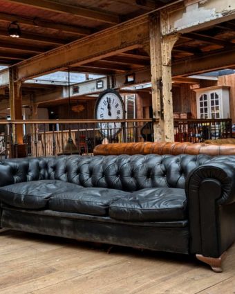 Antique Chesterfield sofa in black leather