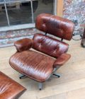 Armchair and ottoman in the style of Charles Eames top