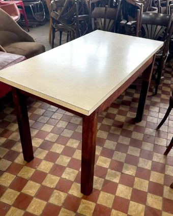 Table with white formica top and wooden base