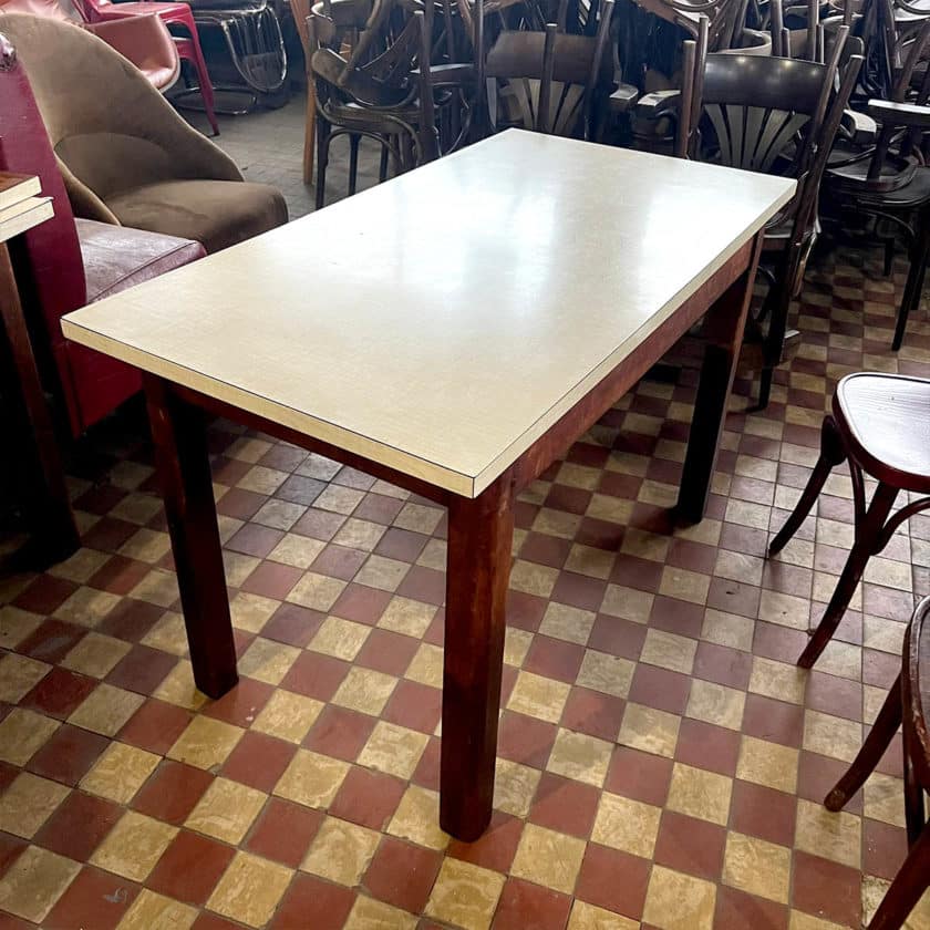 Table with white formica top and wooden base