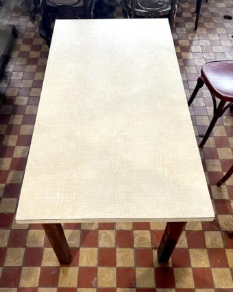 Table with white formica top and wooden base