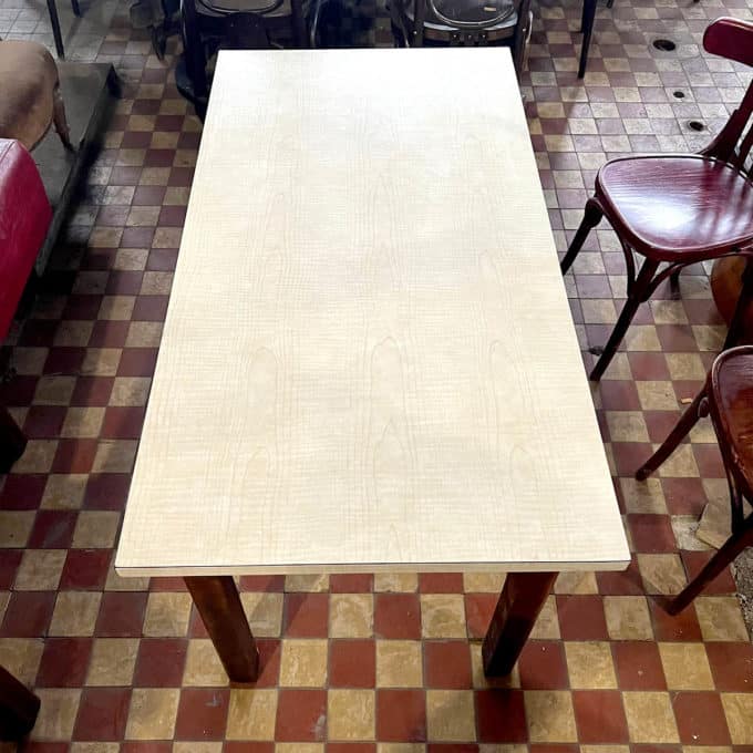 Table with white formica top and wooden base