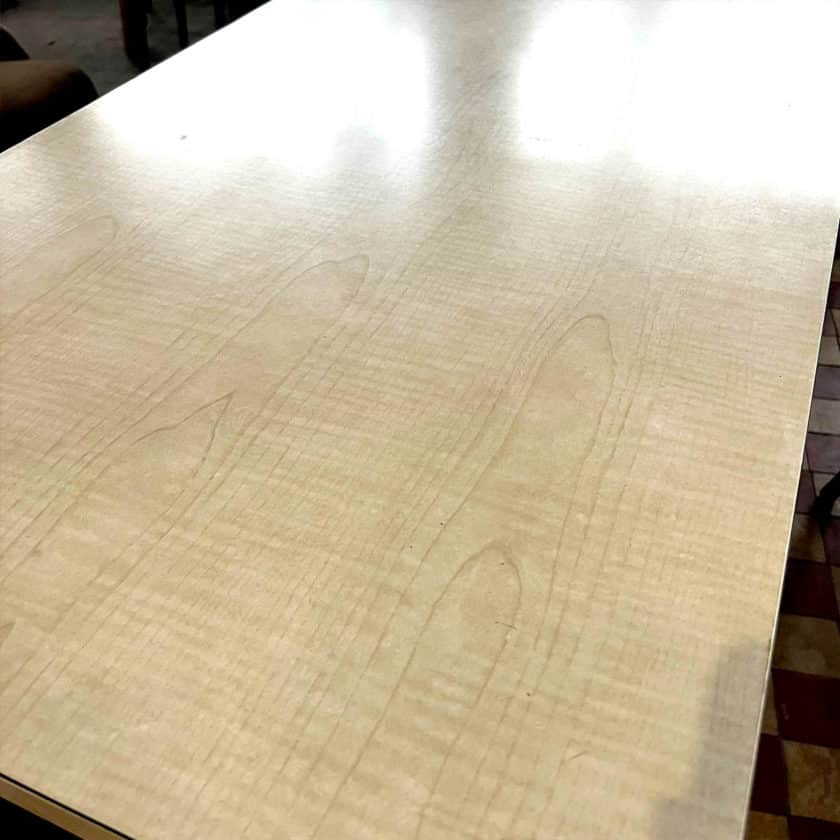 Table with white formica top and wooden base