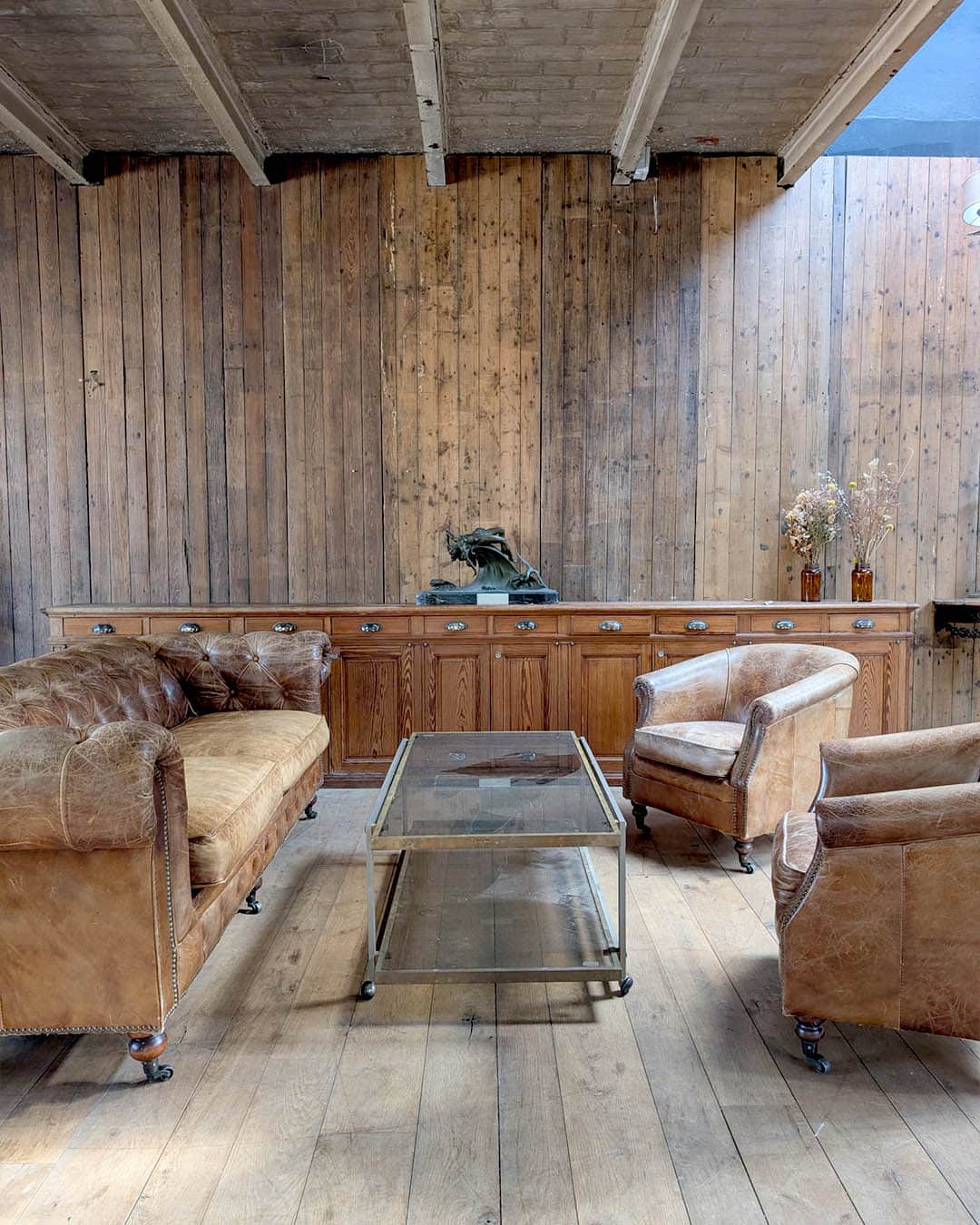 Brown leather chesterfield sofa