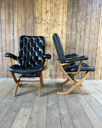 A pair of elegantly designed, comfortable armchairs, perfect for adding a touch of charm and refinement to your home.