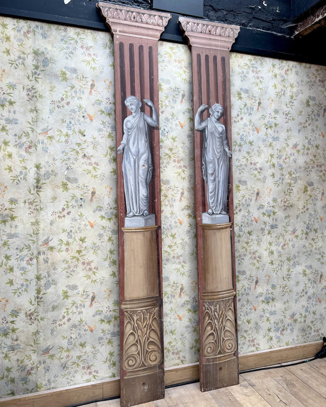 Pairs of wooden stage columns painted in faux marble and after the Antique style.