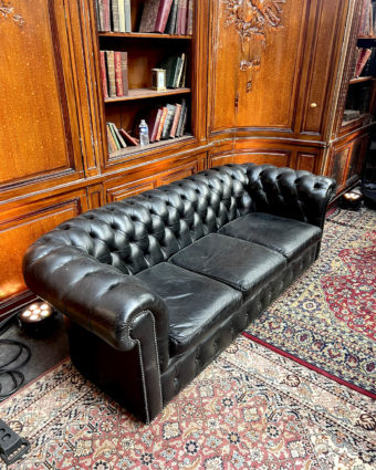 Large chesterfield sofa in black leather top