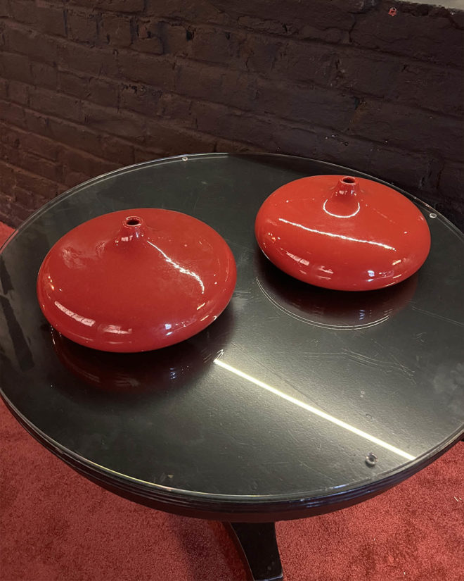 Pair of red lacquered ceramic vases