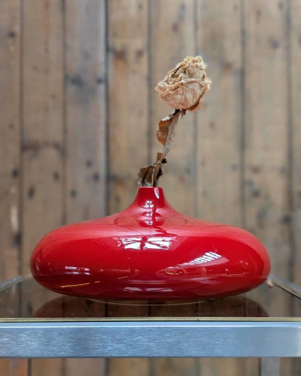 Pair of red lacquered ceramic vases