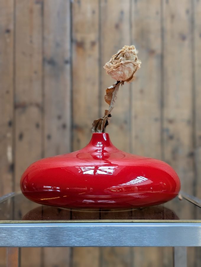 Pair of red lacquered ceramic vases