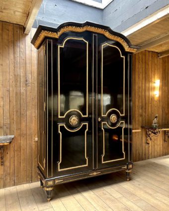 Large cabinet in blackened wood and gilded wood