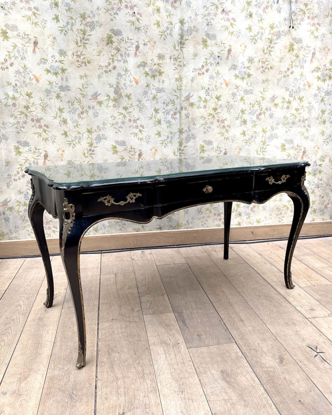 Blackened and gilded wood, flat desk with movement shape