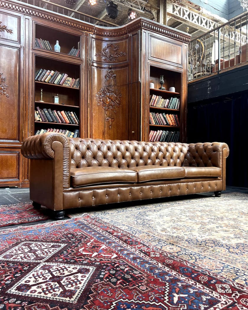 Upholstered leather chesterfield sofa