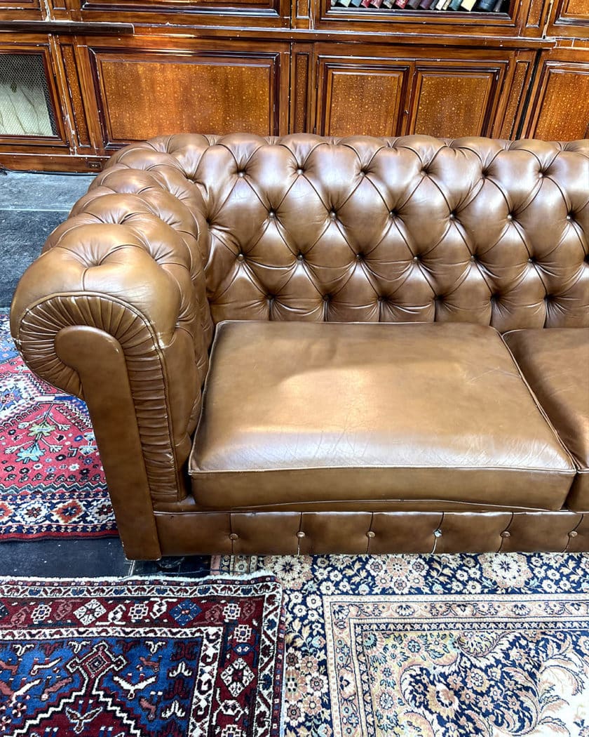 Upholstered leather chesterfield sofa