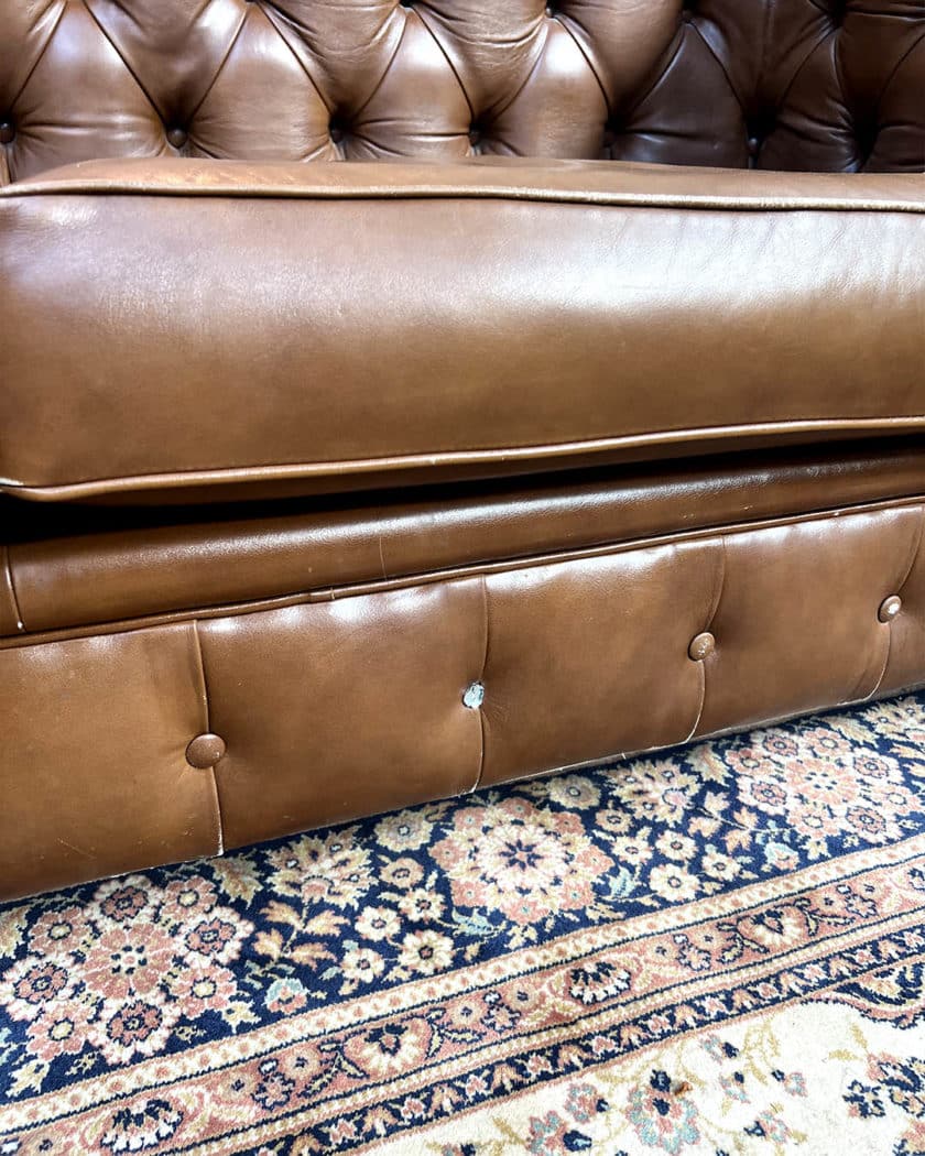 Upholstered leather chesterfield sofa