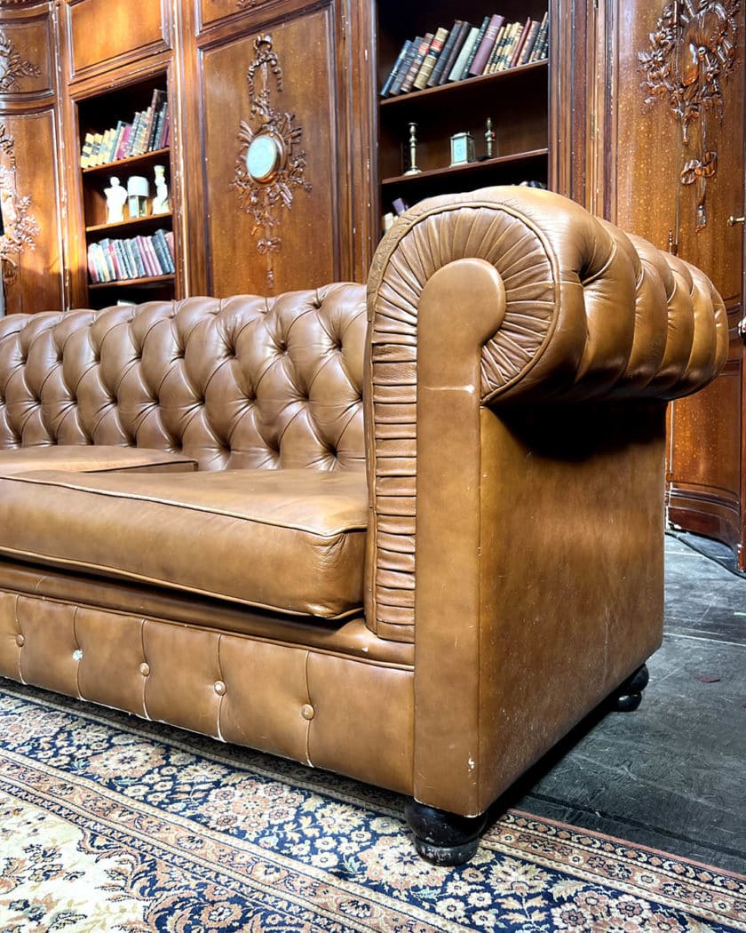 Upholstered leather chesterfield sofa